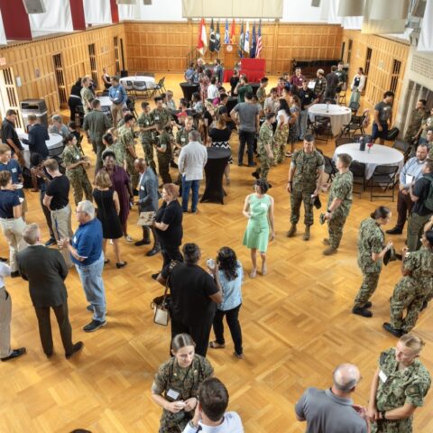 military gathering in a large hall