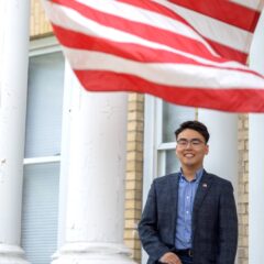 portrait of Andy Shin with American flag